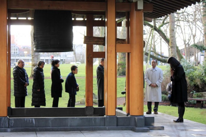 Attendees of Friday's ceremony rang the Kobe Bell to honor the victims of the Great Hanshin Earthquake of 1995. (Photo courtesy of Mara Potter)