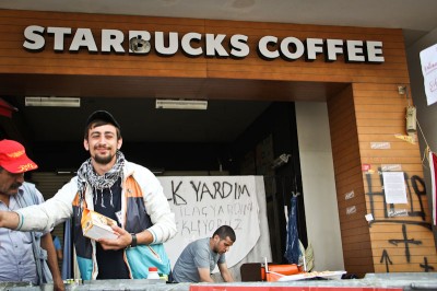 A volunteer handed out food from the patio of the Taksim Square Starbucks in Istanbul, Turkey last week. (Photo by Christan Leonard)