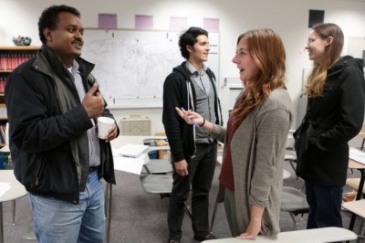 Abdi Mohamed Ali, left, helps Rachel Eagan pronounce Somali words in an evening class held Tuesday at Foster High School. “You need to speak to Somalis,” to learn, Ali says. (Photo by Bettina Hansen / The Seattle Times)