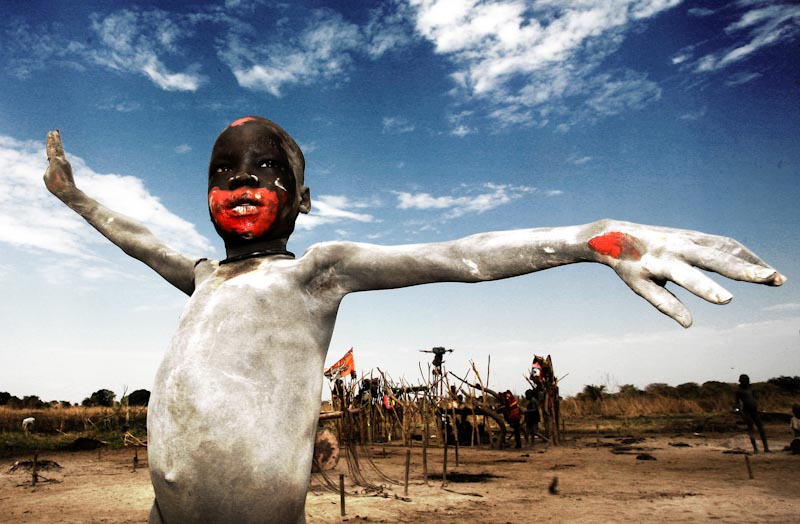 An ash covered Mundarichild celebrates the first South Sudan Independence Day in 2011. (Photo by Giovanni Turco / Freedom House DC)