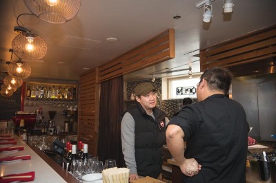 Chef Heong Soon Park (left) prepares for dinner service at Chan Restaurant at Pike Place Market. (Photo by Soyon Im)