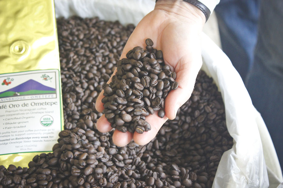 Lee Robinson shows off freshly roasted beans from the Ometepe Island in Nicaragua. (Photo by Hannah Myrick)