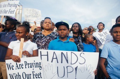Residents of Ferguson, MO took to the streets in August after unarmed teenager Mike Brown was shot by police. (Photo by Jamelle Bouie)