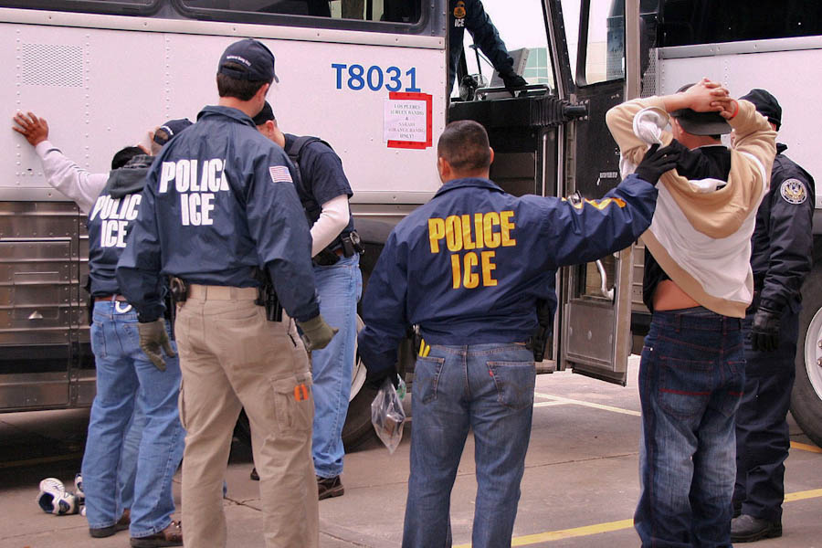 Agents from Immigration and Customs Enforcement arresting suspects during a 2010 raid. More people have been deported under Obama than any previous president. (Photo from ICE)