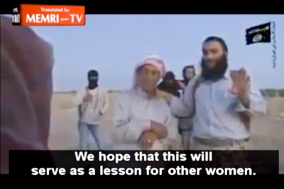 Still from a video circulated last month that appears to show ISIS militants in Syria stoning a women to death for adultery, with the cooperation of her father. (Image via Mideast Media Research Institute)