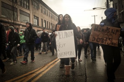 Protestors march up Pike Street toward the Comet Tavern during a Black Friday march responding to the Ferguson grand jury decision. (Photo by Sarah Stuteville)