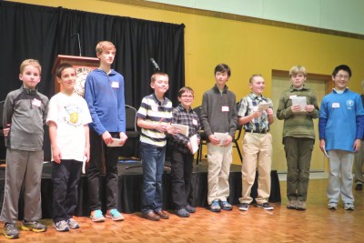 Nine of ten finalists in the Washington State Geographic Bee held in Tacoma on Friday pose after the conclusion of the competition. (Photo by Kyle Haddad-Fonda)