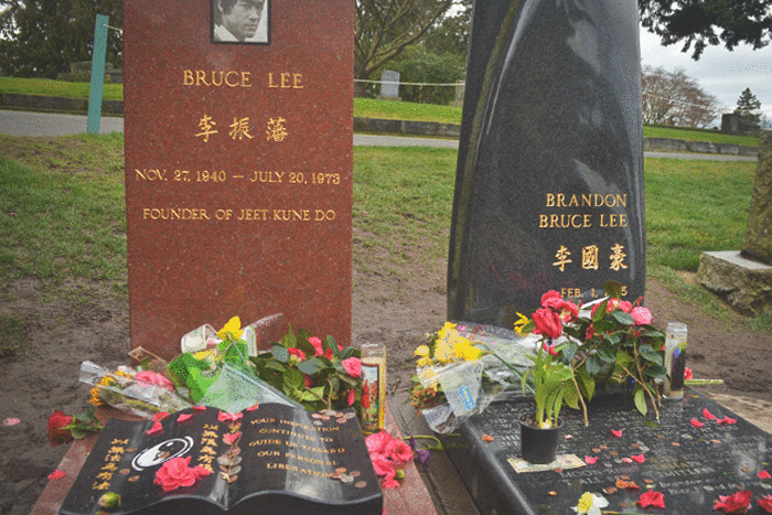 People leave messages and flowers at the grave sites of Bruce Lee and his  son, Brandon Lee. (Photos by Chetanya Robinson) – The Seattle Globalist