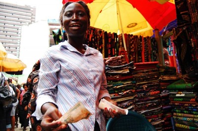 A vendor in the famous Ankara alley of Balogun Market in Lagos. (Photo by Lola Akinmade)