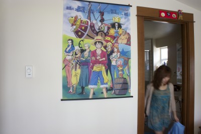 Martina Sun in her room with One Piece poster. (Photo by Tina Lu)