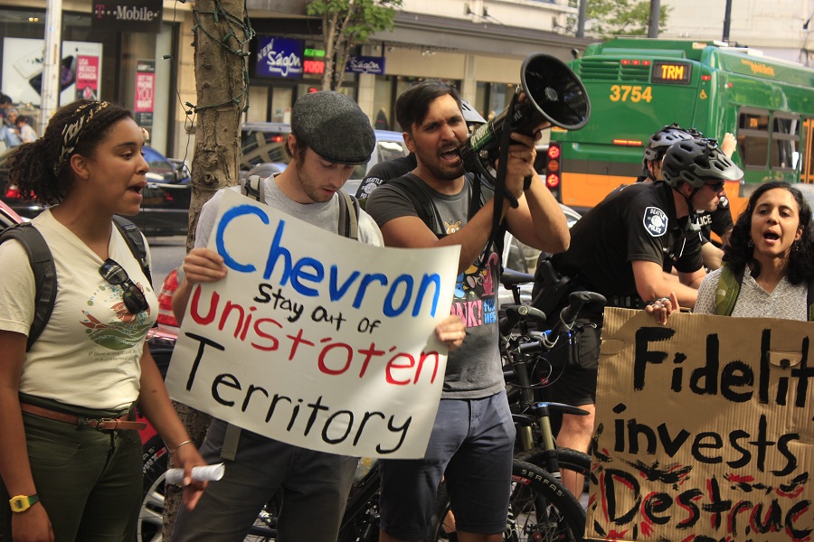 Activists protest against Fidelity Investments, fourth largest Chevron investor outside the office building in Downtown Seattle(Photo by Goorish Wibneh)