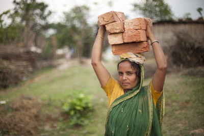 Despite traditional gender roles in Islam, many Bangladeshi women — like this brick-loader in Savar — work in the manual labor force. Photo: Chantal Anderson