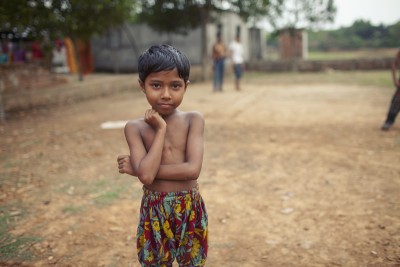 A young girl poses for a portrait after a game of tag in Savar, Bangladesh. Photo: Chantal Anderson