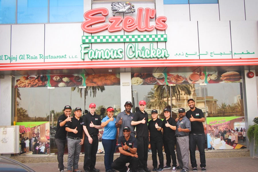The Ezell's training team and local employees outside the new franchise in Sharjah, near Dubai. (Photo via Ezell's website)
