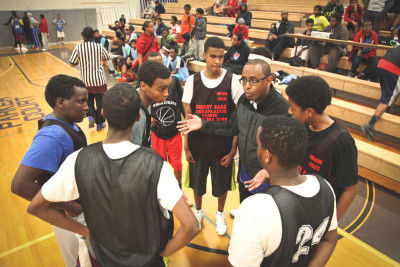 Coach Ar Ahmed rallies East African youth players in the Companion Athletics basketball league. The not-for-profit program is one of several trying to address a perceived generation gap in the community. (Photo by Alex Stonehill)