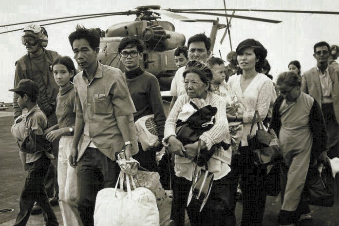 South Vietnamese refugees evacuated on a U.S. Navy vessel during the fall of Saigon in 1975. Thousands of refugees were resettled in the United States. (Photo via U.S. Marines)
