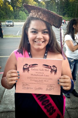 Holding up the first high school diploma in our family, Shalayleeyah Lane celebrates her graduation from Lummi Nation High School. (Courtesy photo)
