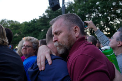 Mourners hug at a gathering at Cal Anderson Park on Sunday to commemorate the victims of a mass shooting at a nightclub in Orlando. (Photo by Chloe Collyer)