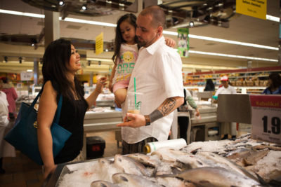 The Hermens family shopping at the Seafood City Supermarket inside Southcenter Mall. The mall draws thousands of people from Seattle and surrounding areas to Tukwila everyday. (Photo by Ian Terry)
