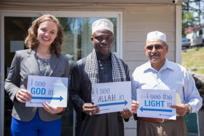 Seattle Quaker community members and peace activists visited the Islamic Center of Federal Way last Ramadan in a show of solidarity and support. Here Megan Fair of CAIR-WA stands with Imam Bazi and Shabbir Ahmed. (Photo by Alex Garland)
