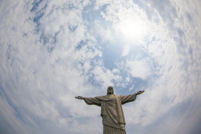 The iconic "Christ the Redeemer" statue stands over Rio de Janeiro. (Photo from Flickr by Geraint Rowland)