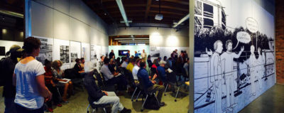 Seattleites gathered at the Center of Architecture and Urban Design, alongside art by Eroyn Franklin in the Boom!: Changing Seattle exhibit, to share their vision for development and preservation of the city. (Photo by Laura Bernstein)