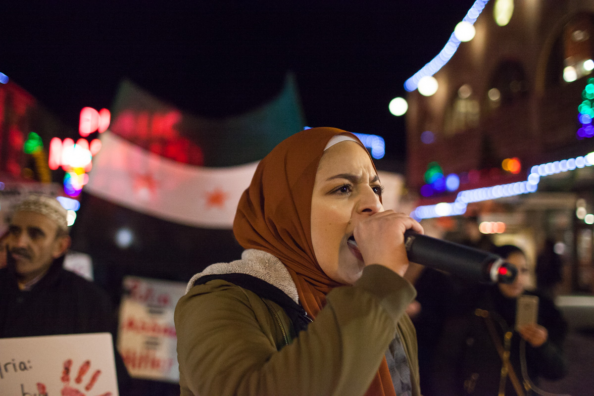 Isra Ayesh leads the March for Aleppo through Pike Market in downtown Seattle on Friday, December 16th. (Photo by Ramon Dompor)