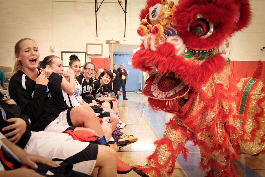 Chief Sealth Junior Allison Steele reacts during a dragon dance ceremony that opened an exhibition game between Nankai High School and Chief Sealth in 2015. (Photo by Alex Stonehill)