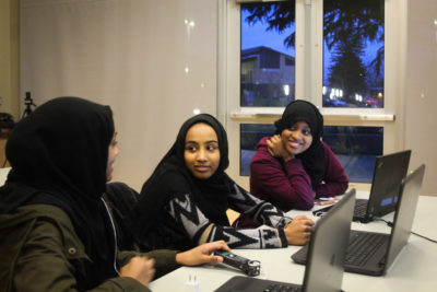 Jemila Abdullah, Iftin Kedir and Munera Mohammed (from left) during a coding class for East African youth held by Companion Athletics. (Photo by Goorish Wibneh)