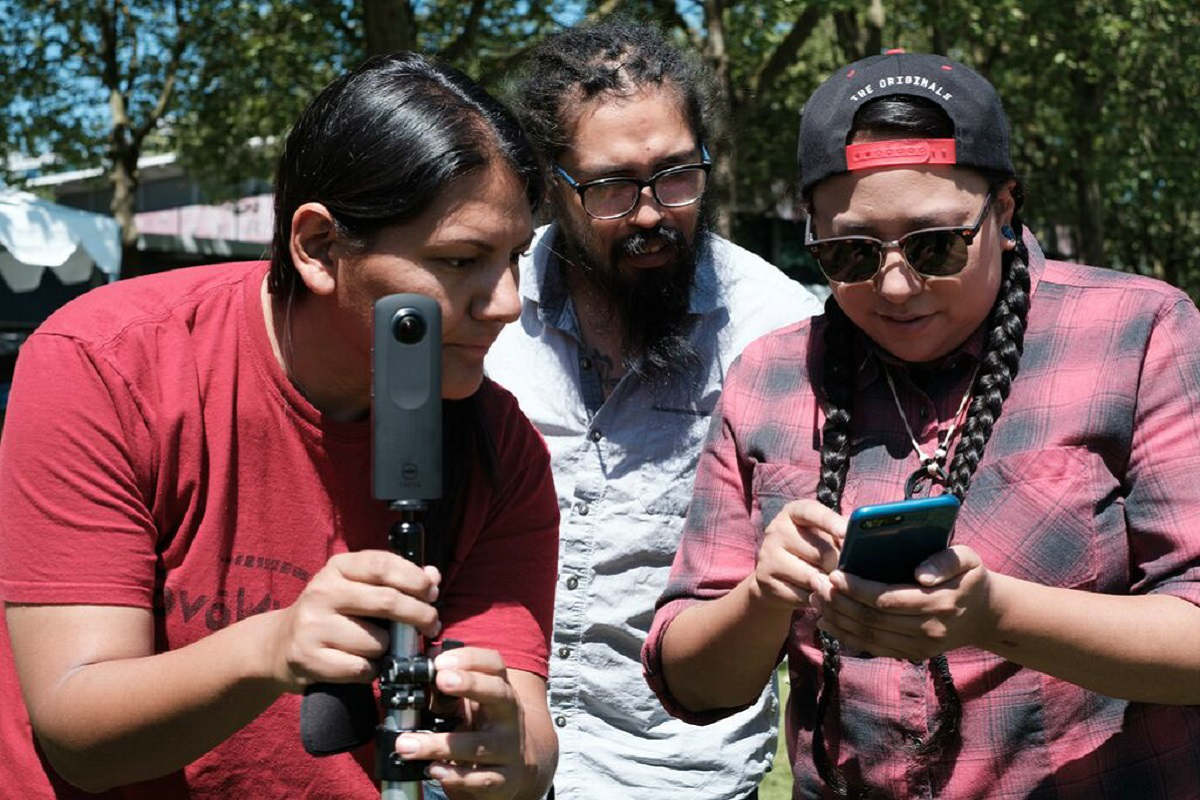Participants in last year’s 4th World Indigenous Media Lab work hands-on with a camera. (Photo Courtesy of Tracy Rector)